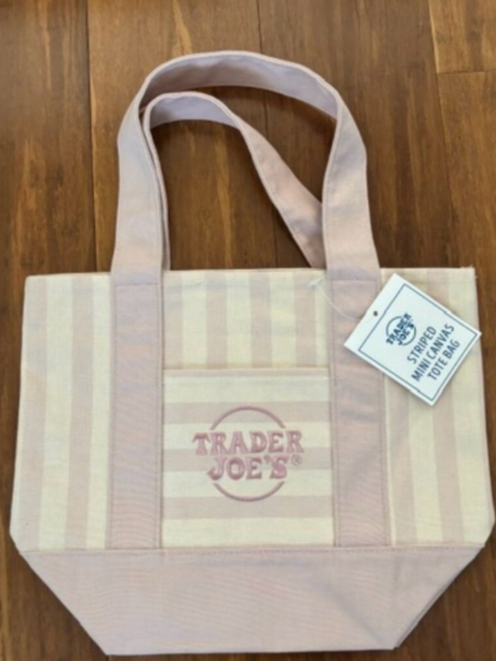 2026 Summer edition Trader Joe’s mini canvas tote in pink and white.